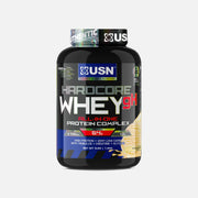 USN Hardcore Whey gH protein scoop and mixed shake in glass