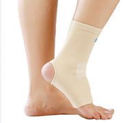 Olympian Ankle Support worn on foot demonstrating open-heel and open-toe design